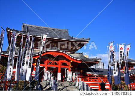 The main hall of Osu Kannon and four votive banners stand out against the blue sky. The main hall of Osu Kannon and four votive banners stand out against the blue sky. 140678391