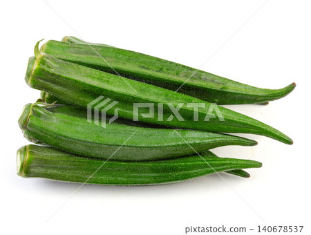 Fresh green okra pods against a white background. Fresh green okra pods against a white background. 140678537