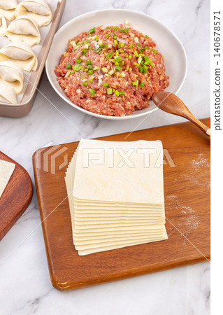 Ingredients for Making Chinese Wontons with Dumpling Wrappers and Minced Meat Stuffing 140678571
