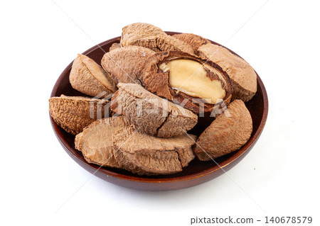 raw Brazil nuts in shells and cracked kernels isolated on a pure white background raw Brazil nuts in shells and cracked kernels isolated on a pure white background 140678579