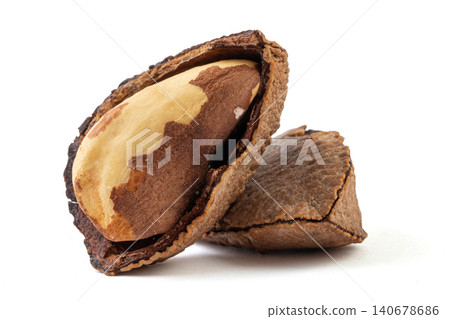 Pile of raw Brazil nuts in shells and cracked kernels isolated on a pure white background 140678686