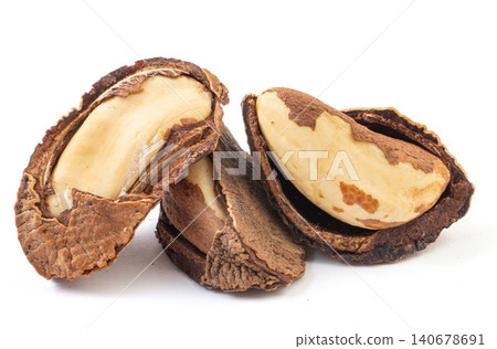 Pile of raw Brazil nuts in shells and cracked kernels isolated on a pure white background 140678691