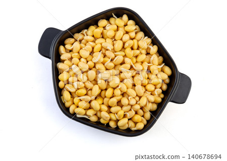 Top view of germinated yellow soybeans with tiny sprouts in a black bowl isolated on white background Top view of germinated yellow soybeans with tiny sprouts in a black bowl isolated on white background 140678694