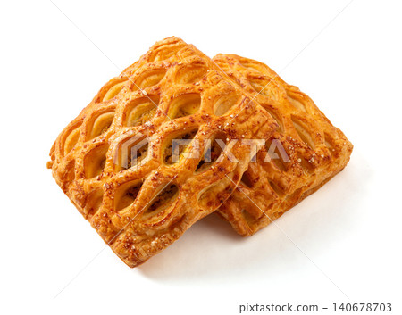 freshly baked lattice puff pastries with savory curry chicken filling isolated on a white background. 140678703