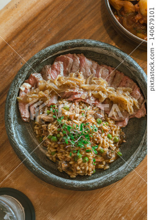 mushroom risotto with australian striploin beef steak mushroom risotto with australian striploin beef steak 140679101