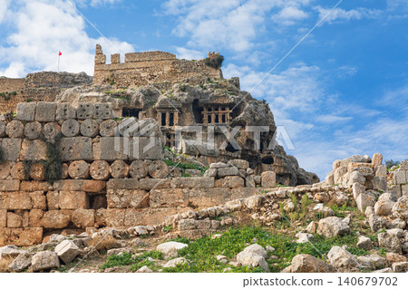 Acropolis, carved in rock tombs of ancient Greek city Tlos in Lycia located on Lycian way. Famous historical site In Antalya region. Popular place for family travel on summer vacation. Fethiye, Turkey Acropolis, carved in rock tombs of ancient Greek city Tlos in Lycia located on Lycian way. Famous historical site In Antalya region. Popular place for family travel on summer vacation. Fethiye, Turkey 140679702