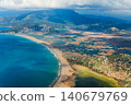 Aerial view of Iztuzu Beach and Dalyan river delta in Mugla, Turkey. Long sandy coastline, lagoon and mountains create a perfect destination for summer family travel, hiking and nature tourism. 140679769
