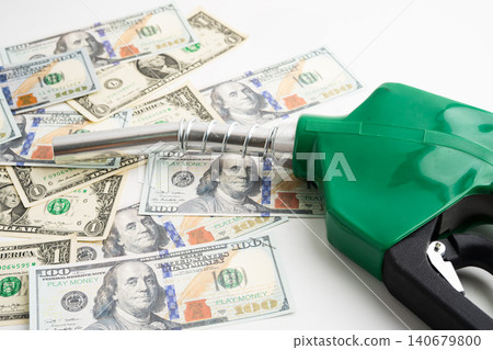 Gas pump, Fuel Nozzle with dollar money for cost energy. Gas pump, Fuel Nozzle with dollar money for cost energy. 140679800