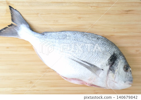 Raw sea fish. A close-up shot of raw fish, cooking delicious food at home. Raw sea fish. A close-up shot of raw fish, cooking delicious food at home. 140679842