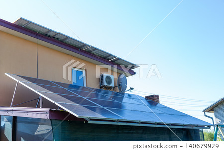 Home solar energy system on private house exterior Home solar energy system on private house exterior 140679929