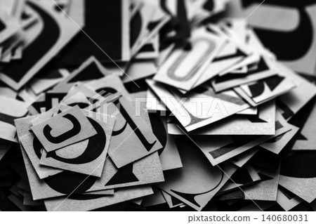 Pile of many black and white letters from newspapers and magazines. Typography background composition. 140680031