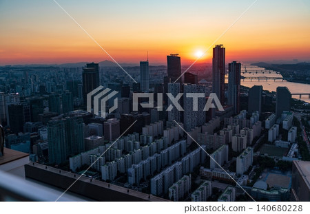 Golden sunset over the financial district of Yeouido with modern corporate skyscrapers in Seoul, South Korea Golden sunset over the financial district of Yeouido with modern corporate skyscrapers in Seoul, South Korea 140680228