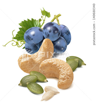 Cashew nut, blue grapes, sunflower and pumpkin seeds isolated on white background. Vertical layout Cashew nut, blue grapes, sunflower and pumpkin seeds isolated on white background. Vertical layout 140680340