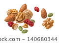 Almond and walnut nuts, dried cranberry, green pumpkin seeds isolated on white background 140680344