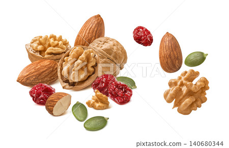 Almond and walnut nuts, dried cranberry, green pumpkin seeds isolated on white background Almond and walnut nuts, dried cranberry, green pumpkin seeds isolated on white background 140680344