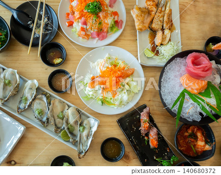 Top view of big meal with assorted and various sushi, sashimi japanese food. 140680372
