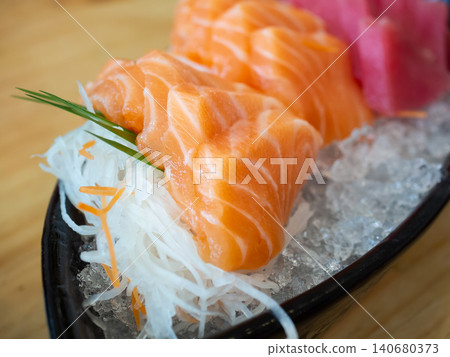 Japanese sashimi set (salmon, tuna) with dry ice smoke. Japanese sashimi set (salmon, tuna) with dry ice smoke. 140680373