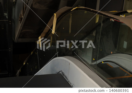 Close up view of curved glass panels and structural metal frames in a modern building interior Close up view of curved glass panels and structural metal frames in a modern building interior 140680391
