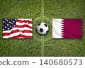 USA vs. Katar flags on a soccer field 140680573
