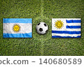 Argentina vs. Uruguay flags on soccer field 140680589