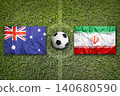 Australia vs. Iran flags on a soccer field 140680590