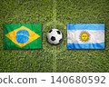 Brazil vs. Argentina flags on soccer field 140680592