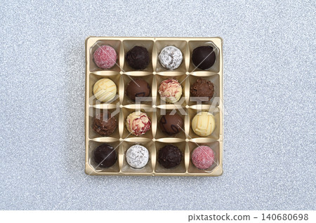 Chocolate candies arranged in square box. Chocolate candies arranged in square box. 140680698
