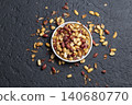 Pile of roasted peanuts on black background, space for text 140680770
