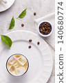 Refreshing iced coffee, with roasted coffee beans, on white background 140680774