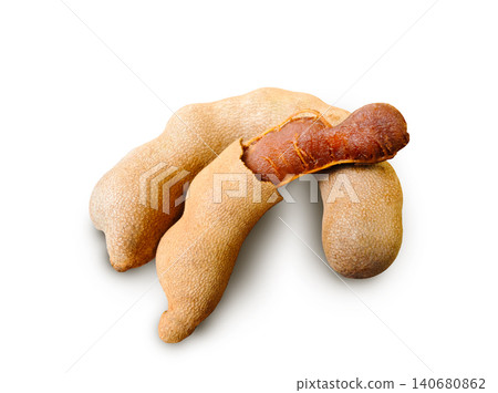 Golden Brown Ripe Tamarind with Sweet Natural Flavor and Rustic Tropical Appeal on white background. Golden Brown Ripe Tamarind with Sweet Natural Flavor and Rustic Tropical Appeal on white background. 140680862
