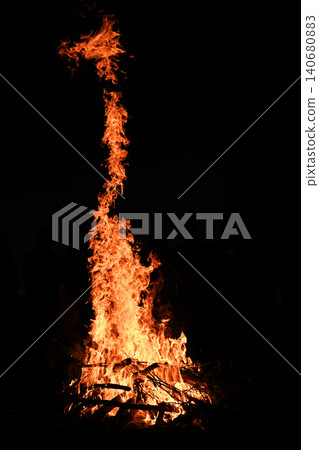 Flame rises vertically at night against deep black background, Flame rises vertically at night against deep black background, 140680883