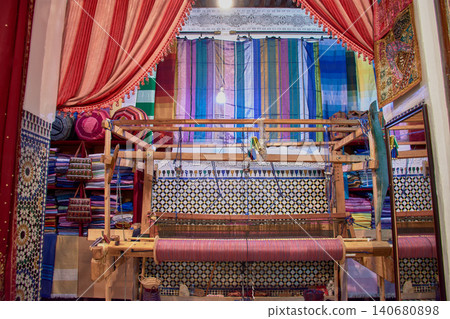 A local bazaar displays traditional leather crafts and textiles typical of Maghrebi culture in Fez, Morocco A local bazaar displays traditional leather crafts and textiles typical of Maghrebi culture in Fez, Morocco 140680898