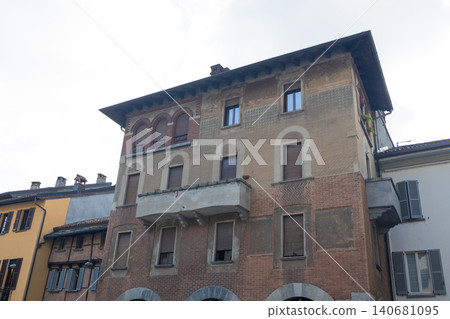 Historical European building facade with classic stone architecture and balconies Historical European building facade with classic stone architecture and balconies 140681095