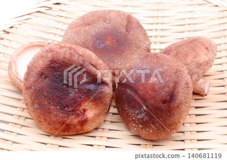 Image of fresh shiitake mushrooms arranged on a bamboo sieve. Image of fresh shiitake mushrooms arranged on a bamboo sieve. 140681119
