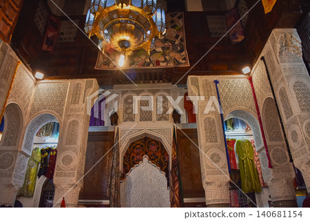 Intricate carved stucco reliefs adorn the walls of a traditional palace in the medina of Fez, Morocco. Intricate carved stucco reliefs adorn the walls of a traditional palace in the medina of Fez, Morocco. 140681154