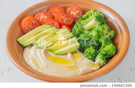 Healthy Hummus Bowl With Avocado Broccoli And Cherry Tomatoes 140681306