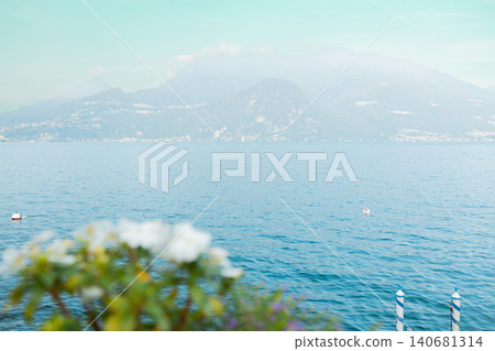 Sailboat on Lake Como against a mountain backdrop Sailboat on Lake Como against a mountain backdrop 140681314