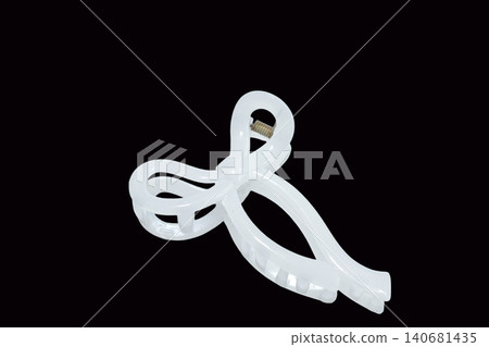 White hair clip with a bow White hair clip with a bow 140681435