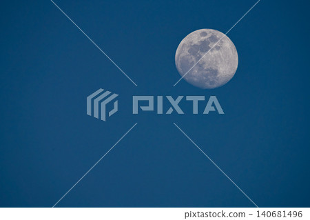 moon floating in the blue sky moon floating in the blue sky 140681496