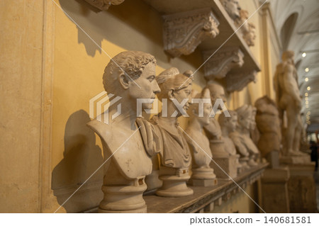 Row of classical marble bust statues in historic museum gallery interior Row of classical marble bust statues in historic museum gallery interior 140681581