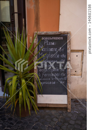 Italian pizzeria blackboard menu on street restaurant terrace Italian pizzeria blackboard menu on street restaurant terrace 140681586