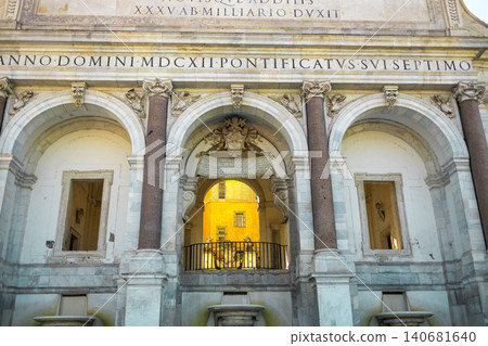Ancient Roman marble facade with majestic arches, columns and latin inscriptions on historic building. 140681640