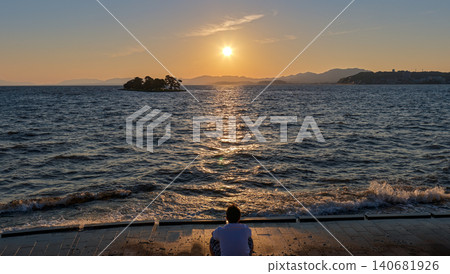 A moment to watch the sunset over Lake Shinji A moment to watch the sunset over Lake Shinji 140681926