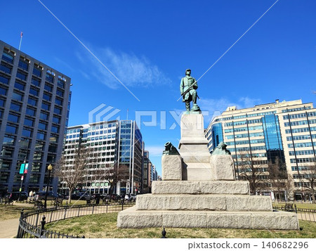 A monument to Admiral David Farragut, located in the center of Farragut Square, surrounded on all sides by modern high-rise office buildings with panoramic glazing A monument to Admiral David Farragut, located in the center of Farragut Square, surrounded on all sides by modern high-rise office buildings with panoramic glazing 140682296