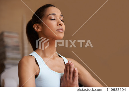 Yoga, meditation and woman in home in lotus pose for training, exercise and zen mindset. Fitness, mental health and person with prayer hands for wellness, mindfulness and pilates in living room Yoga, meditation and woman in home in lotus pose for training, exercise and zen mindset. Fitness, mental health and person with prayer hands for wellness, mindfulness and pilates in living room 140682304