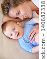 Baby, bonding and happy with mother, relaxing and love together with child and care for motherhood. Infant, mom and smile for affection, nurture and home for growth and babysitting with family 140682338