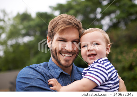 Portrait, smile or father with toddler in outdoor, love or together in nature for child growth or development. Happy family, dad or holding kid for bonding, face or responsibility for son on weekend Portrait, smile or father with toddler in outdoor, love or together in nature for child growth or development. Happy family, dad or holding kid for bonding, face or responsibility for son on weekend 140682342