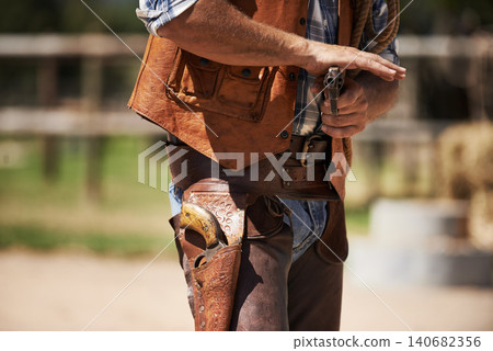 Cowboy, tough and aim gun to shoot for standoff or gunfight in duel for wild western culture in Texas. Male gunslinger or outlaw, revolver and confrontation for defense or conflict with closeup 140682356