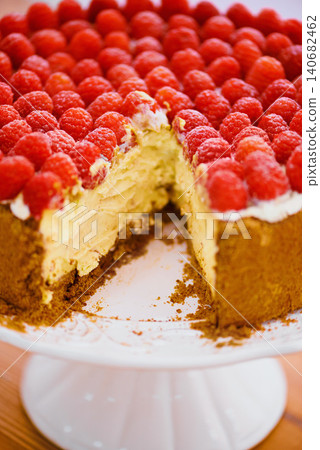 Food, dessert and cheesecake for bakery, raspberries and sweet snack for eating. Fruit, cream and cake stand for display on table in pastry restaurant, creamy and luxury baked confection with berries Food, dessert and cheesecake for bakery, raspberries and sweet snack for eating. Fruit, cream and cake stand for display on table in pastry restaurant, creamy and luxury baked confection with berries 140682462