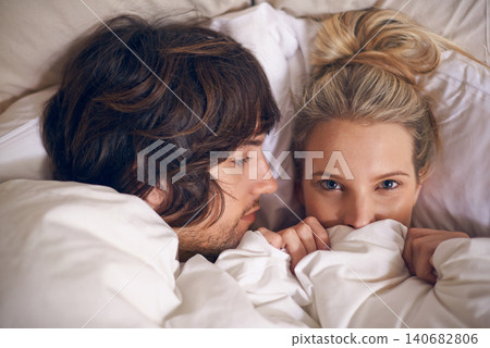 Love, blanket and couple relax in a bed with trust, care and safety, support and security in their home from above. Rest, cuddle and people in a bedroom for afternoon, weekend or day off nap in house Love, blanket and couple relax in a bed with trust, care and safety, support and security in their home from above. Rest, cuddle and people in a bedroom for afternoon, weekend or day off nap in house 140682806